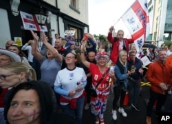 FILE - English fans wait in front of the Bramall Lane Stadium prior the Women Euro 2022 semi final soccer match between England and Sweden in Sheffield, England, July 26, 2022.