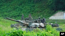South Korean army soldiers prepare for an exercise at a training field in Paju, South Korea, near the border with North Korea, July 27, 2022.