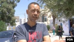 Voter Adel Zine backs Saied. (Lisa Bryant/VOA)