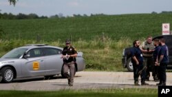 Policija blokira ulaz u park Makoketa posle pucnjave u kojoj je ubijeno troje ljudi, 22. jula 2022. 