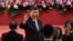 FILE - China's President Xi Jinping waves following his speech after a ceremony to inaugurate the city's new leader and government in Hong Kong on July 1, 2022.