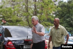 Cuba's President Miguel Diaz-Canel reacts as he arrives at a hotel to meet with relatives of victims of the previous day's Boeing 737 plane crash, in Havana, Cuba, May 19, 2018.