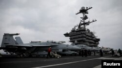 F-18 fighter jets are seen on the flight deck of the USS Harry S. Truman aircraft carrier in the eastern Mediterranean Sea, May 5, 2018.
