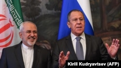 RUSSIA -- Russian Foreign Minister Sergei Lavrov (R) gestures next to his Iranian counterpart Mohammad Javad Zarif during a family photo ahead of a meeting of foreign ministers of the Caspian Sea littoral states in Moscow, December 05, 2017