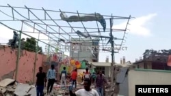 People inspect a damaged playground following an air strike in Mekelle, the capital of Ethiopia's northern Tigray region, Aug. 26, 2022.