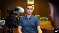 Ukrainian Health Minister Viktor Liashko speaks to The Associated Press reporters during an interview on Friday, Aug. 12, 2022.