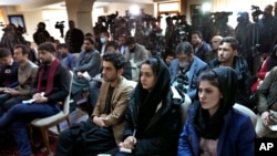 Afghan Journalists attend a press conference of a former president Hamid Karzai in Kabul, Afghanistan, Feb. 13, 2022.