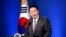 South Korean President Yoon Suk Yeol delivers a speech during a news conference to mark his first 100 days in office at the presidential office in Seoul, South Korea, Aug. 17, 2022. 