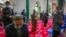 FILE - Uyghurs pray at the Id Kah Mosque in Kashgar in far west China's Xinjiang region, as seen during a government-organized visit for foreign journalists, April 19, 2021.