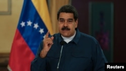 Venezuela's President Nicolas Maduro speaks during a meeting with ministers at the Miraflores Palace in Caracas, Venezuela, Aug. 13, 2018. 