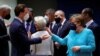 Germany's Chancellor Angela Merkel, right, talks to Austrian Chancellor Sebastian Kurz during an EU summit at the European Council building in Brussels, Belgium, June 24, 2021. 