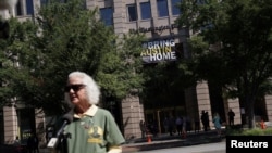 Debra Tice, mother of Austin Tice, speaks to a television reporter during an unveiling of a "#BringAustinHome" banner honoring Austin Tice outside The Washington Post's offices in Washington, D.C., Aug. 9, 2022. Austin Tice was abducted in Syria on Aug. 14, 2012. 