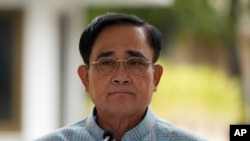 Thai Prime Minister Prayuth Chan-ocha arrives at Government house in Bangkok, Thailand, Tuesday, Aug. 16, 2022. (AP Photo/Sakchai Lalit)