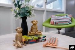 Statuettes of meditating monkeys sit on a table at Venado Middle School's Well Space in Irvine, Calif., on July 28, 2022. Districts across the country are using federal pandemic money to hire more mental health specialists, rolling out new coping tools and expanding curriculum that prioritizes emotional health. (AP Photo/Eugene Garcia)