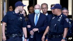 The Trump Organization's former Chief Financial Officer Allen Weisselberg, center, leaves court, in New York, Aug. 18, 2022.