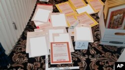 This image contained in a court filing by the Department of Justice on Aug. 30, 2022, and redacted in part by the FBI, shows a photo of documents seized during the Aug. 8 search by the FBI of former President Donald Trump's Mar-a-Lago estate. 
