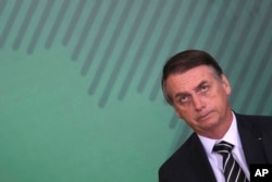 FILE - Brazil's President Jair Bolsonaro holds a ceremony to present his cabinet members at the presidential palace in Brasilia, Jan. 2, 2019.