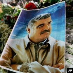 A photo of slain Lebanese former Prime Minister Rafiq Hariri is seen on his grave at Martyr's Square, central Beirut, Lebanon, 03 Mar 2005