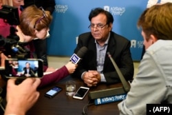 FILE - Pakistani lawyer Saiful Mulook speaks to journalists during a press conference in The Hague, Nov. 5, 2018, after fleeing Pakistan due to threats following his latest victory in court during which he defended a Christian woman convicted of blasphemy.