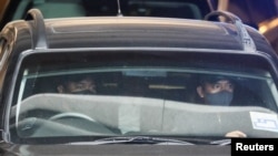 A car carrying former Malaysian Prime Minister Najib Razak leaves the Federal Court, in Putrajaya, Malaysia, Aug. 23, 2022.