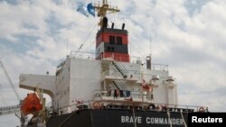 The bulk carrier Brave Commander is seen during loading with wheat for Ethiopia, amid Russia's war on Ukraine, in the sea port of Yuzhne, Odesa region, Ukraine, Aug. 14, 2022.