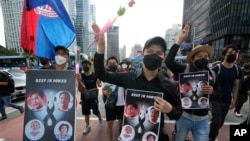FILE - Myanmar nationals living in South Korea march to condemn Myanmar's recent executions of activists, at the down town in Seoul, South Korea, Saturday, July 30, 2022.