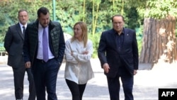 FILE - Leader of Lega party leader Matteo Salvini, Fratelli d'Italia party leader Giorgia Meloni and Forza Italia party leader Silvio Berlusconi at the end of their meeting in Rome, Oct. 20, 2021. (Photo by Claudio Peri/ ANSA / AFP)