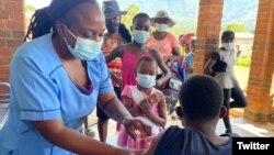 Children are administered the measles vaccine at an inoculation site in the country's Manicaland province. (Twitter - @WHO_Zimbabwe)