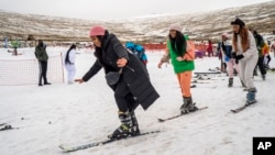 First time skiers take a lesson at the Afriski ski resort near Butha-Buthe, Lesotho, Saturday July 30, 2022.  (AP Photo/Jerome Delay)