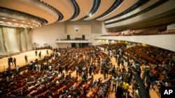 FILE - Followers of Shiite cleric Muqtada al-Sadr fill the parliament hall during a sit-in protest, in Baghdad, Iraq, Aug. 4, 2022. Iraq’s top judicial body said Sunday, Aug. 14, 2022, that it doesn't have the authority to dissolve the country’s parliament.