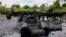 FILE - An abandoned illegal oil refinery is seen at the creeks of Bayelsa, Nigeria, May 18, 2013.