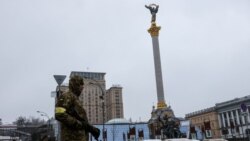 soldier stands guard in front of bars and sand barriers at the Independence Square, as Russia's invasion of Ukraine continues, in Kyiv, Ukraine March 2, 2022. REUTERS/Umit Bektas