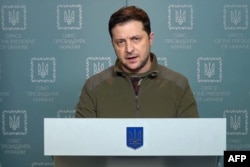 This handout video grab taken and released by the Ukraine Presidency press service on February 28, 2022 shows Ukrainian President Volodymyr Zelensky delivering an address in Kyiv. (Photo by UKRAINE PRESIDENCY / AFP)