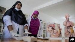 Medical students demonstrate how female genital mutilation (FGM) affects childbirth, at the Edna Adan University in Hargeisa, Somaliland, Feb. 9, 2022.