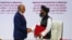Mullah Abdul Ghani Baradar, the leader of the Taliban delegation, and Zalmay Khalilzad, U.S. envoy for peace in Afghanistan, shake hands after signing an agreement at a ceremony between members of Afghanistan's Taliban and the U.S. in Doha, Qatar…