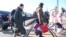 Ukrainian refugees arrive from their homeland at Zahonyi railway station close to the Hungarian-Ukrainian border, Feb. 27, 2022.
