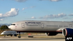 FILE - A Russian Aeroflot airlines plane takes off from Los Angeles International Airport, Feb. 22, 2022. - Canada has now closed its airspace to all Russian carriers in protest of the Russian invasion of Ukraine.
