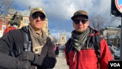 Oleksandr, aged 34, and Ihor, 42, say they have to east to fight.“ We have not been called up because there are no places and so we go as volunteers and there are a lot who want to fight against the Russian invasion,” Oleksandr, says. (Jamie Dettmer/VOA)