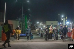 Izbeglice iz Ukrajine stižu na granični prelaz Medjuka, Poljska, 27. februara 2022.