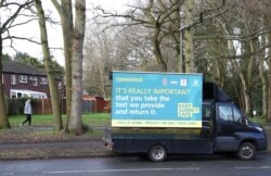 An advertisement board is seen, amid the outbreak of coronavirus disease in Woking, Britain, Feb. 2, 2021.