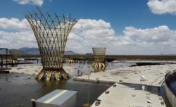 Unfinished parts of the flight terminal at an abandoned construction site of a Mexico City airport are now flooded by summer rains, in Texcoco on the outskirts of Mexico City, Mexico, Sept. 4, 2020.