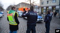 Police close the streets around a Christmas market after a suspicious object was found in Potsdam, eastern Germany, Dec. 1, 2017.