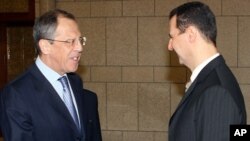 Syrian President Bashar al-Assad, right, shakes hands with Russian Foreign Minister Sergei Lavrov (2008 file photo)