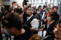 Parents of investigative journalist Jan Kuciak arrive at the Slovak Supreme Court for the public hearing of Marian Kocner, in Bratislava, Slovakia, June 15, 2021.
