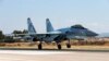 FILE - This Sept. 26, 2019 file photo, shows a Russian Su-35 fighter jet taking off at Hemeimeem air base in Syria.