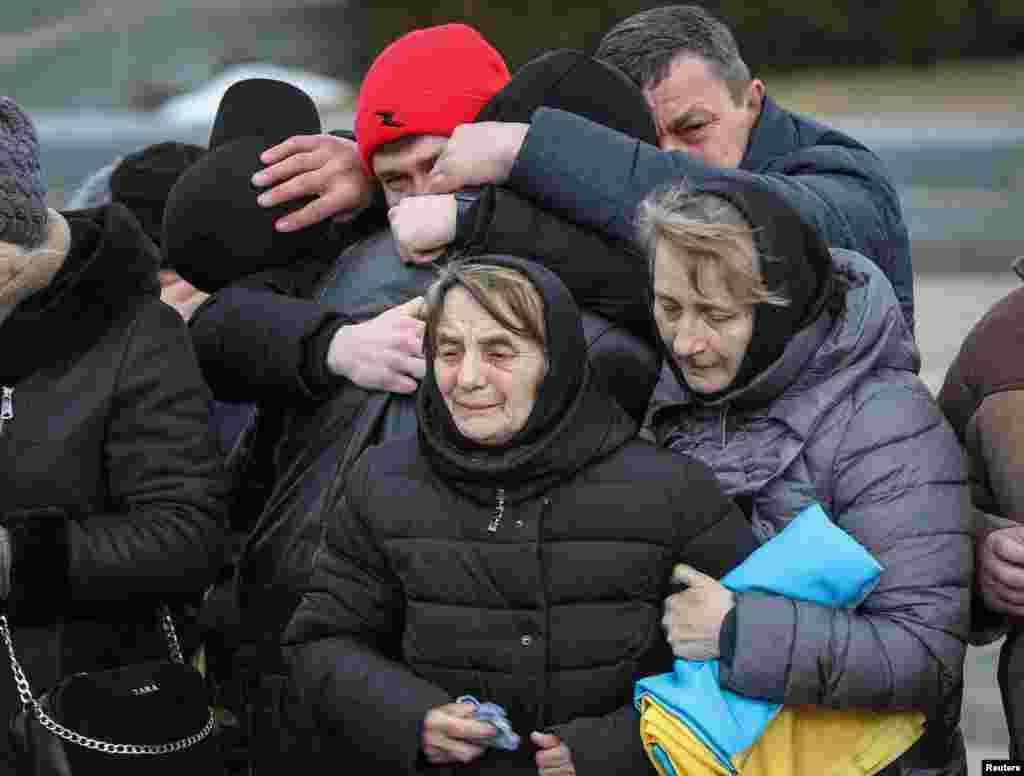 Myroslava Dudar attends the funeral of her son Viktor Dudar and Ivan Koverznev, of Ukrainian servicemen killed on March 2, during Russia&#39;s invasion of Ukraine, at an 18th-century Lychakiv cemetery, in Lviv, March 8, 2022.