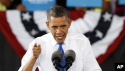President Barack Obama gestures during a rally in Virginia Beach, Virginia, September 27, 2012.