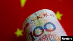 FILE - A China yuan note is seen in this illustration, May 31, 2017.