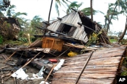 FILE - A house lays in ruins after Cyclone Batsirai in Mananjary, Madagascar, Feb. 10, 2022.