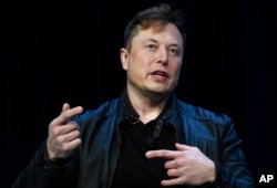 FILE -Tesla and SpaceX Chief Executive Officer Elon Musk speaks at a conference in Washington, March 9, 2020.